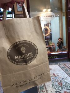 Brown kraft store bag outside the Haigh's Chocolates store in Melbourne