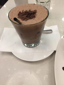 glass of the Vegan Chocolate Frappe with straw, spoon and chocolate shavings at Ganache Chocolate in Melbourne