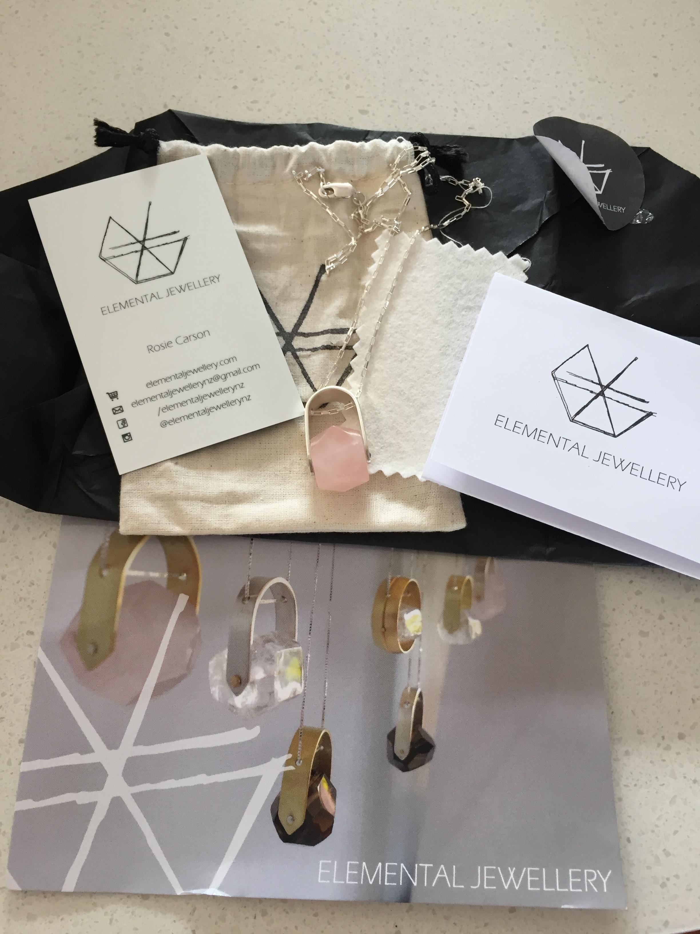 when I first opened my jewelry package-necklace, cards, cleaning cloth, instructions and packaging from Elemental Jewellery