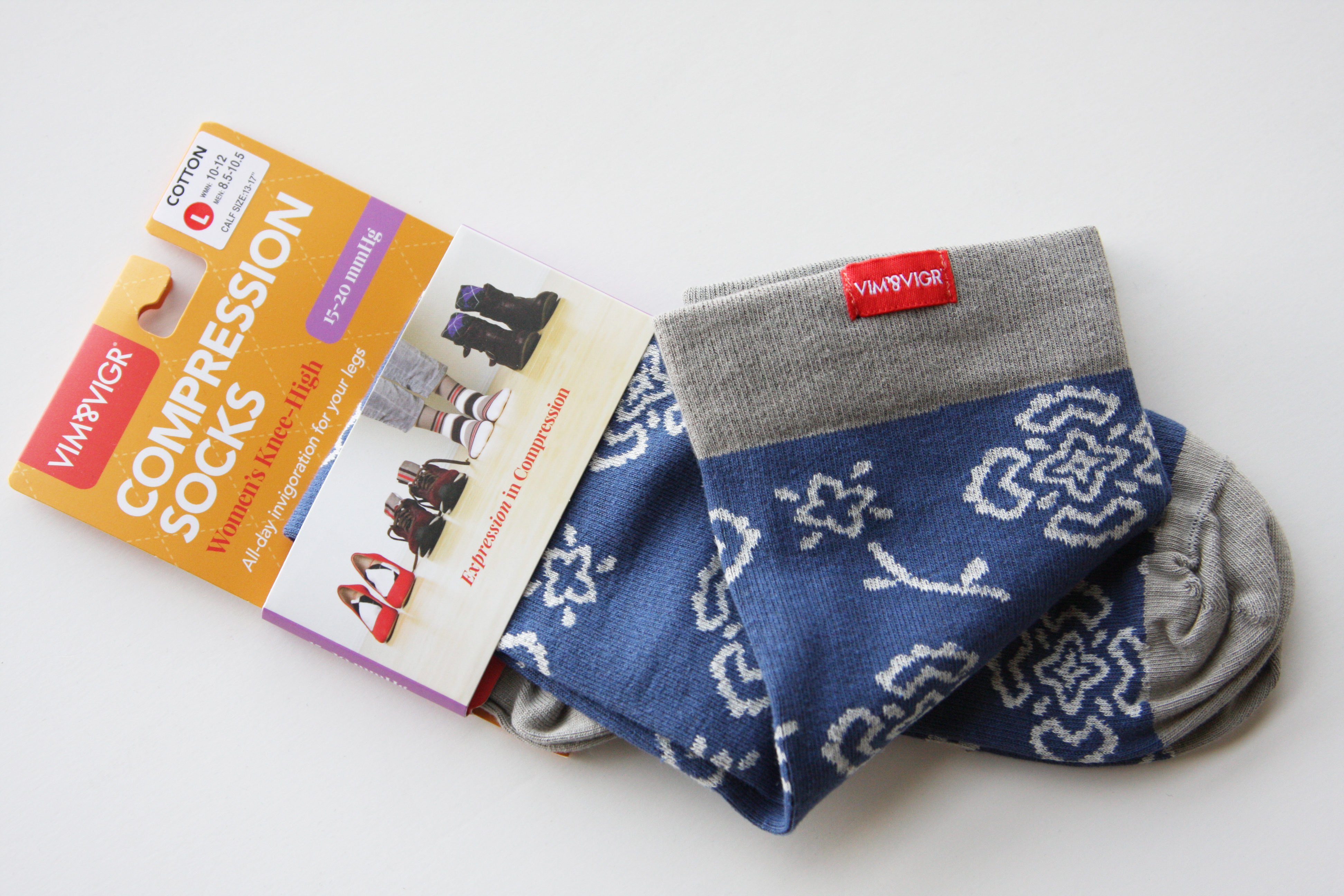 VIM & VIGR Compression Socks in package with folded socks