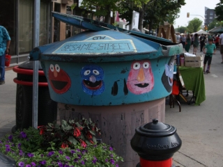 Art even for the garbage in Saskatoon Sesame Street art covering a garbage can on the street in Saskatoon