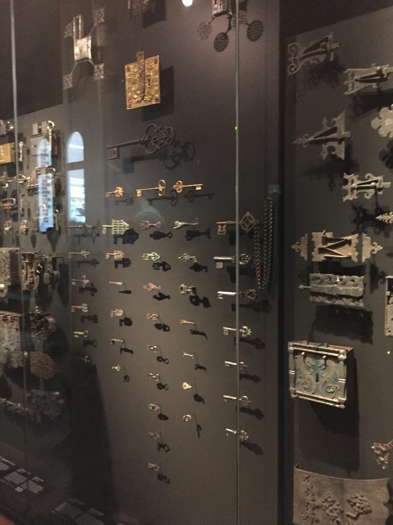 collection of keys and locks in a glass case at the Rijksmuseum in Amsterdam
