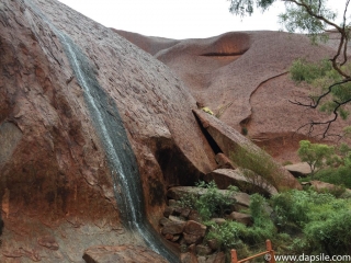 Rain and Uluru on tour from Alice Springs to Uluru