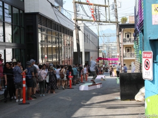 Mural Festival Skaters and Pedestrians Sharing Summer Street Festivals in the Vancouver Area