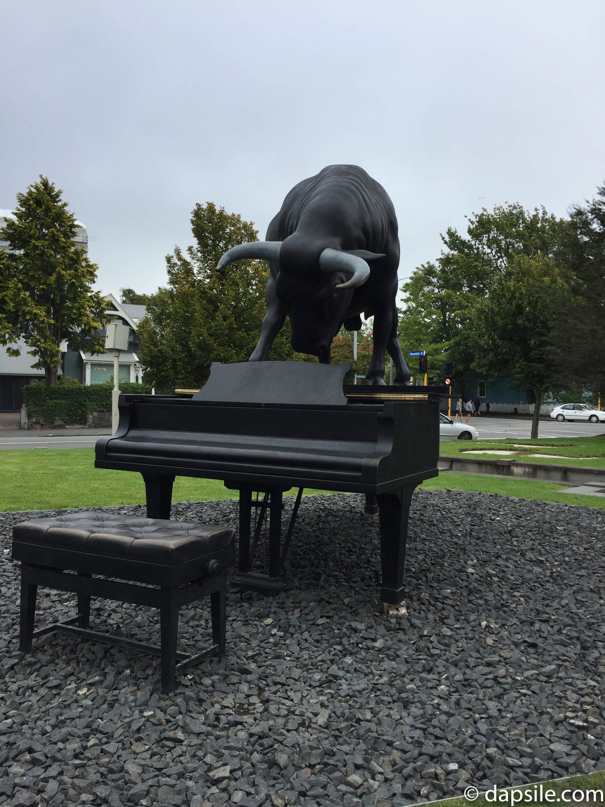 Bull on a piano as art in front of the Christchurch Te Puna o Waiwhetu Art Gallery