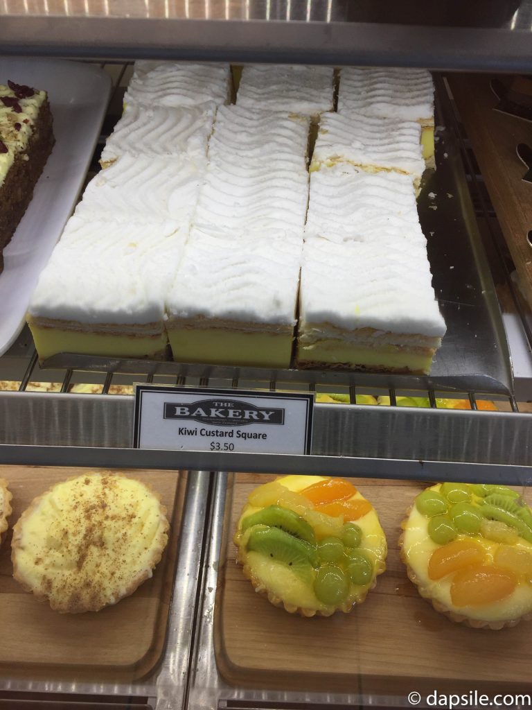 Kiwi Custard Square and other treats on the shelf in The Bakery The Doughbin