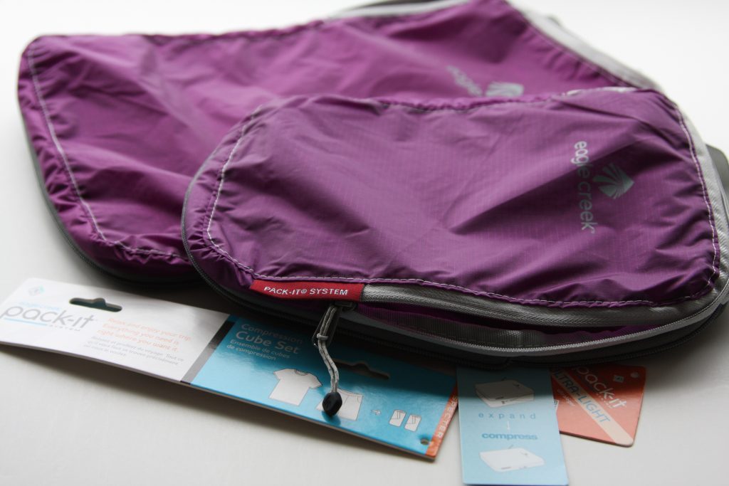 Two Eagle Creek Compression Bags in Different Sizes unpacked and laying flat